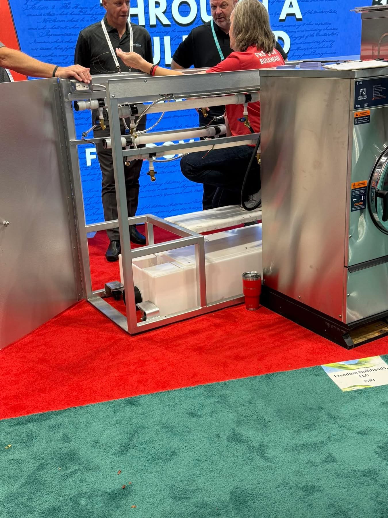 CT drain troughs installed inside a Freedom Bulkheads laundry install at a trade show